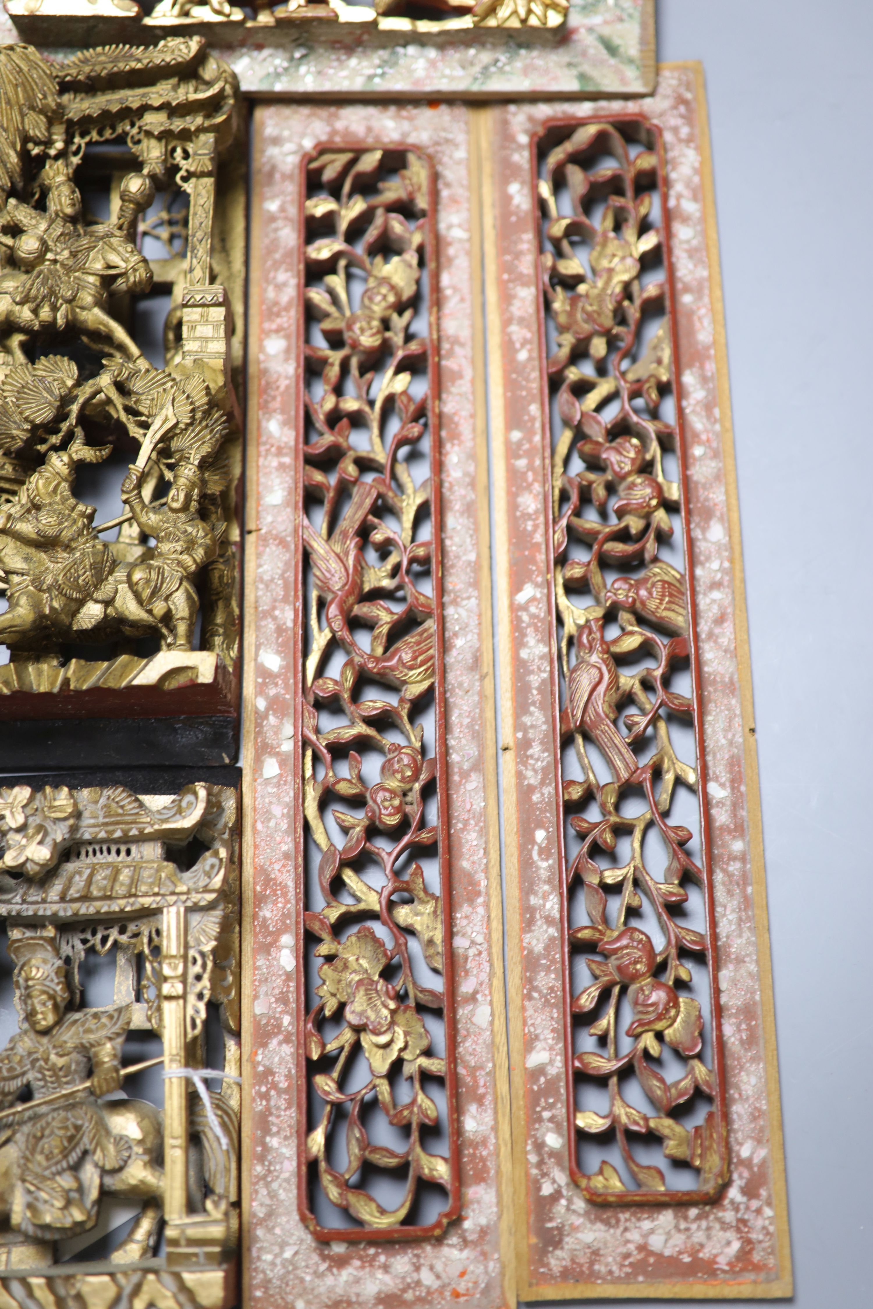 Five Chinese lacquer carved panels, longest 42cm